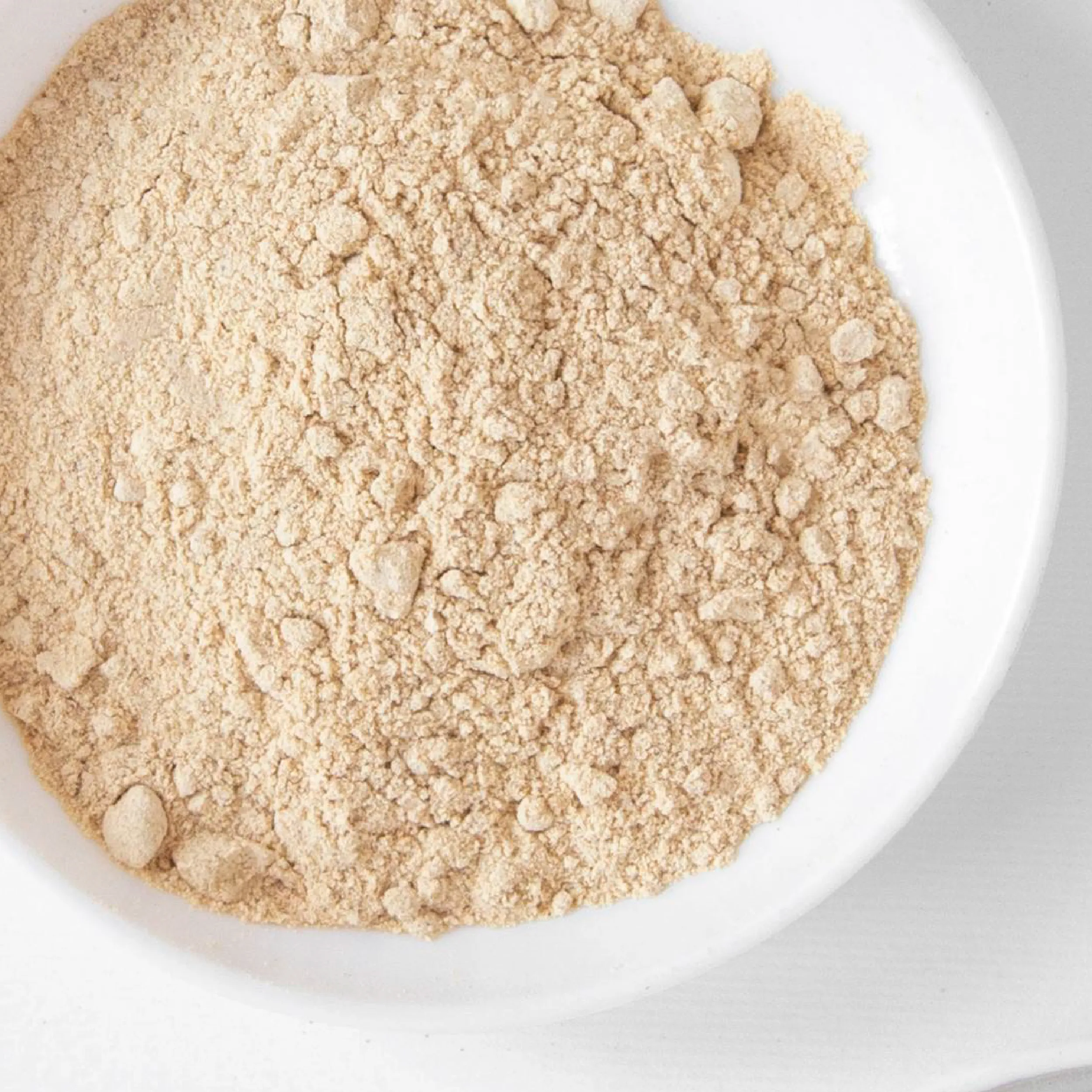 Pueraria mirifica powder extract in a white bowl