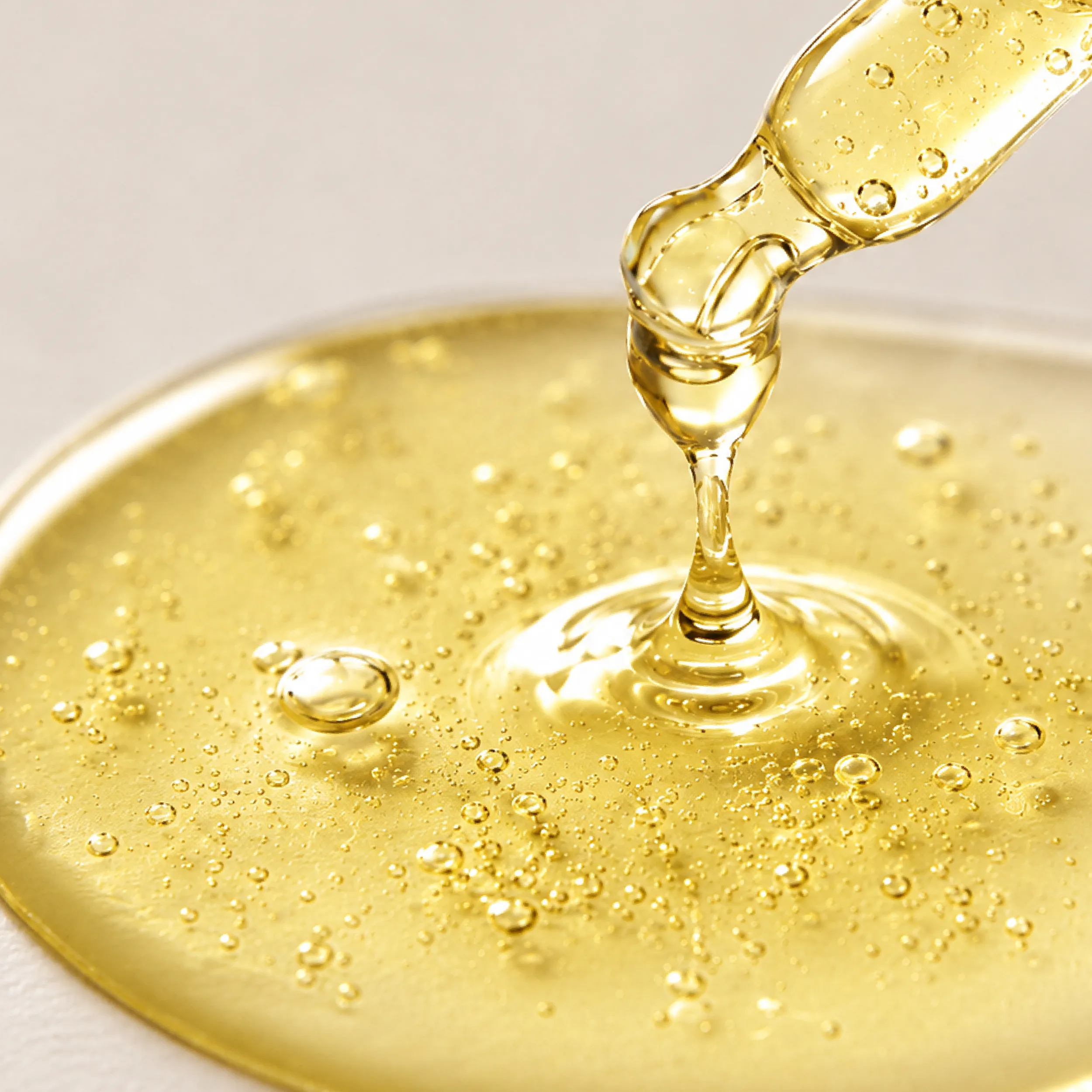Liquid Pueraria mirifica extract dripping from a dropper